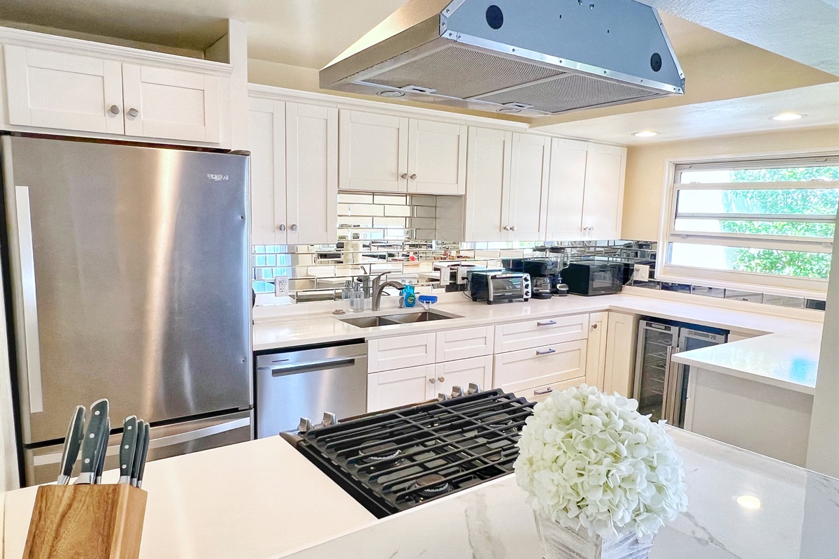 Cook, snack, or mix up a drink in this stylish and functional kitchen.