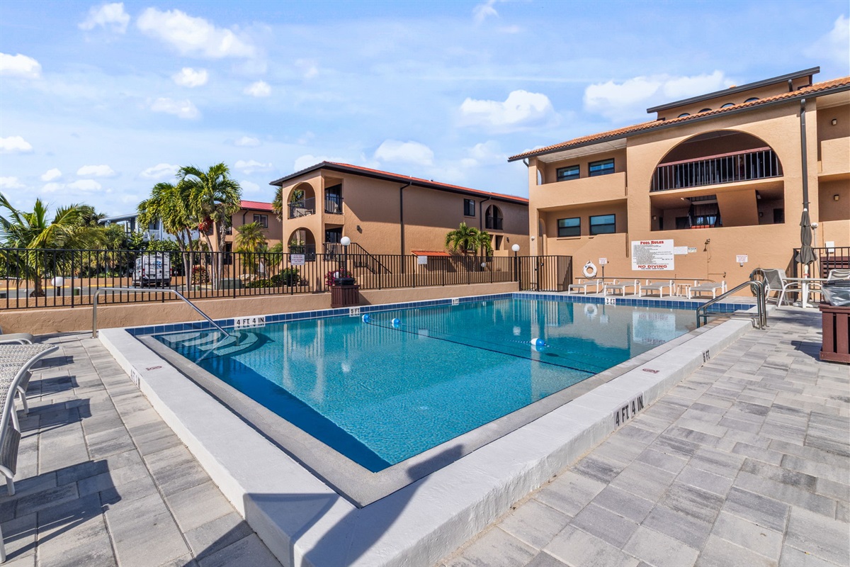 Heated pool is just steps away from the unit.