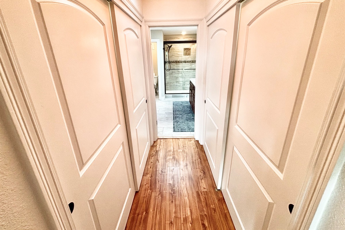 His and her’s closet in the master bedroom leading to large master bath