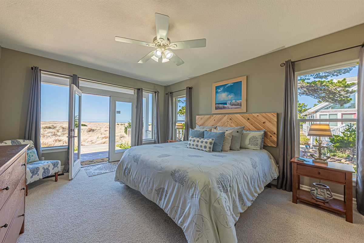 Primary bedroom on main floor with king bed & 55" Smart TV.