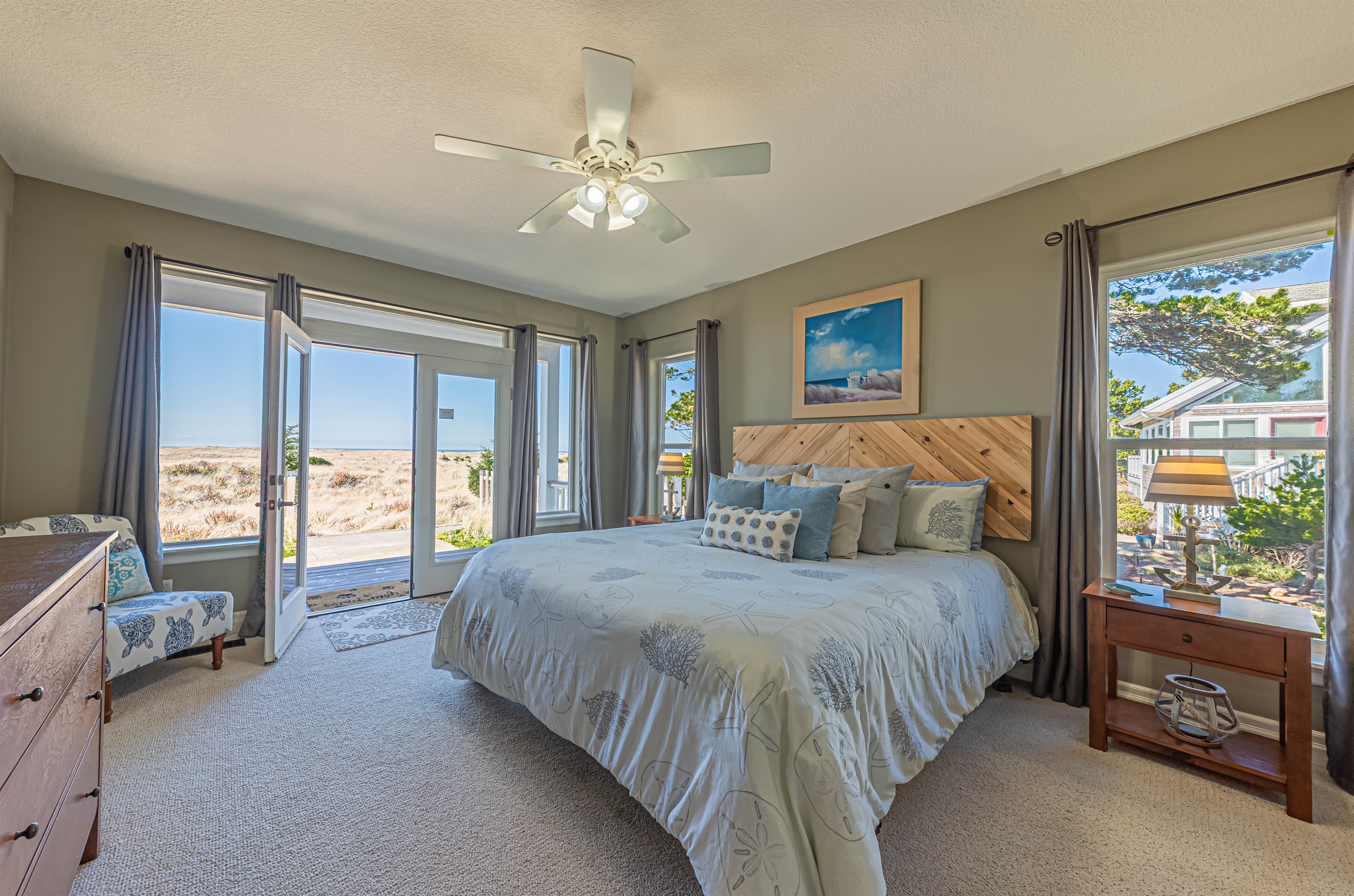 Primary bedroom on main floor with king bed & 55" Smart TV.