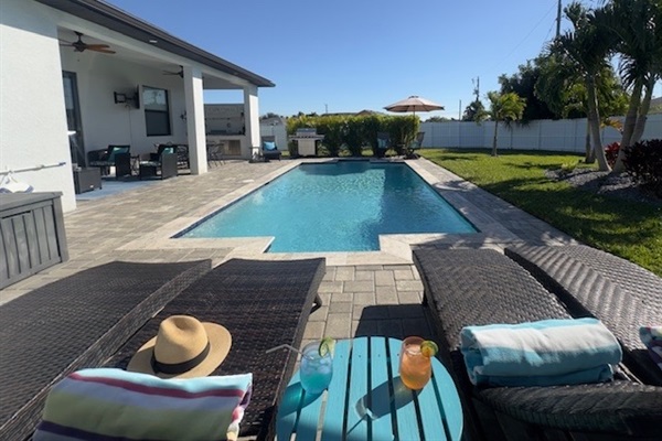 Soak up the Florida sunshine or bask in the shade with our oversized umbrella beside the pool!