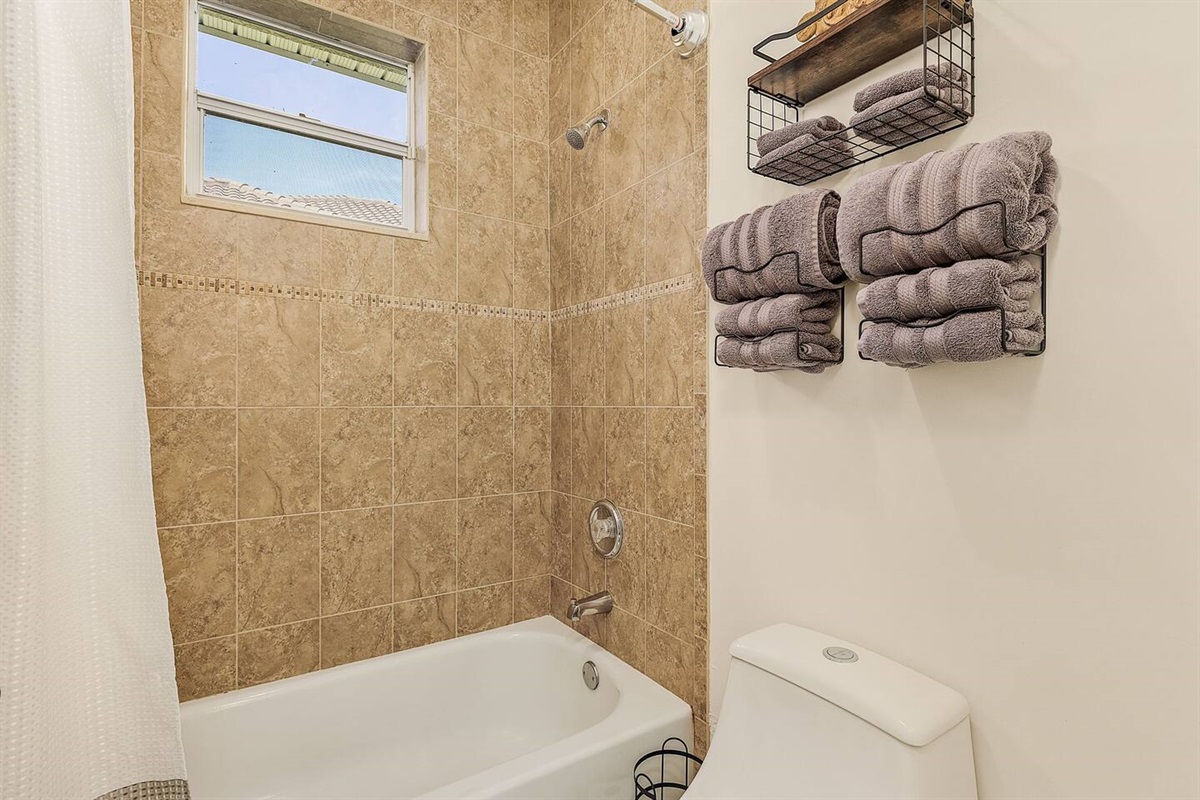 1st Guest bathroom featuring a shower and tub combo!