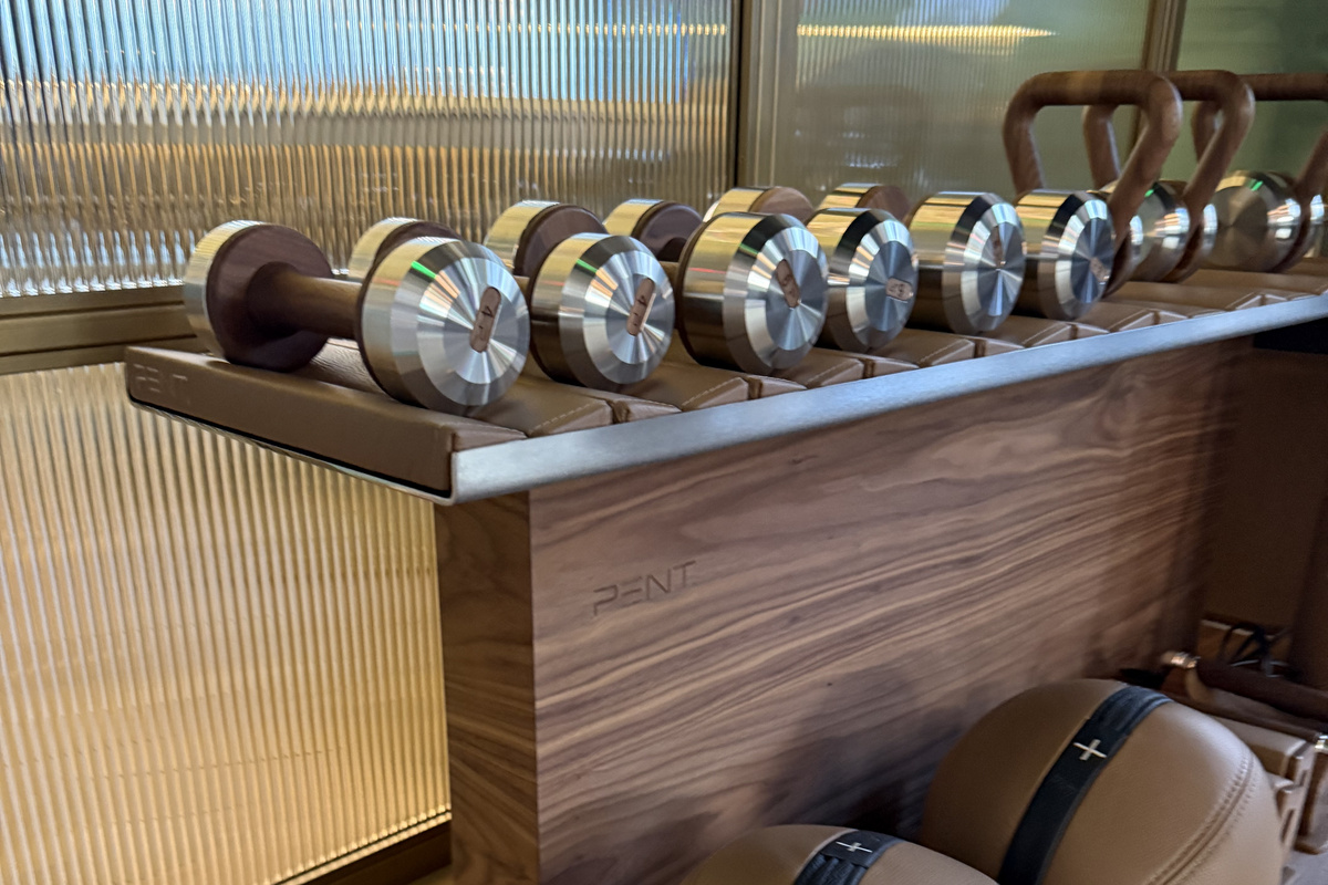 A fully racked free-weight station in the building's fitness center - no gym membership required.