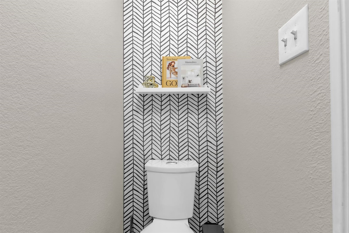 Separate, private toilet room within the primary bathroom, offering added convenience and privacy for shared stays.