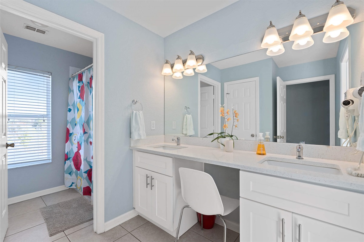 Upstairs shared bathroom with shower/tub