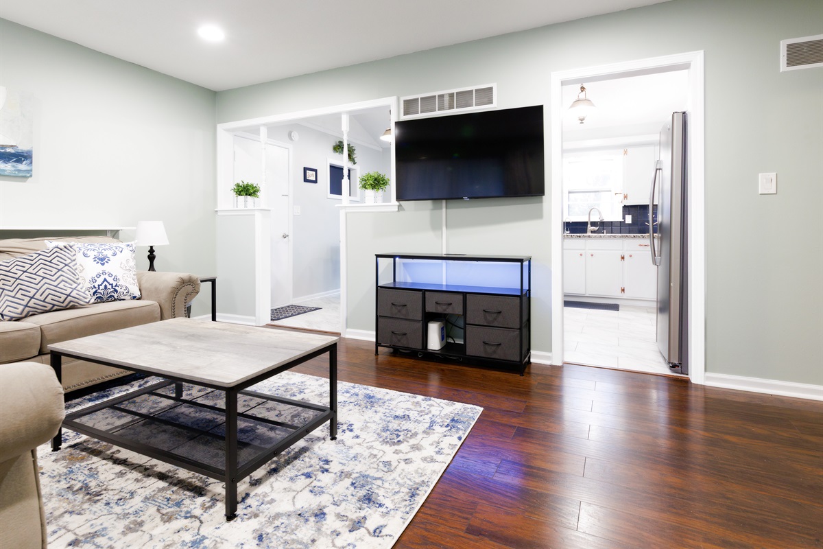 Relaxing living space with TV and open layout, perfect for unwinding or gathering together.