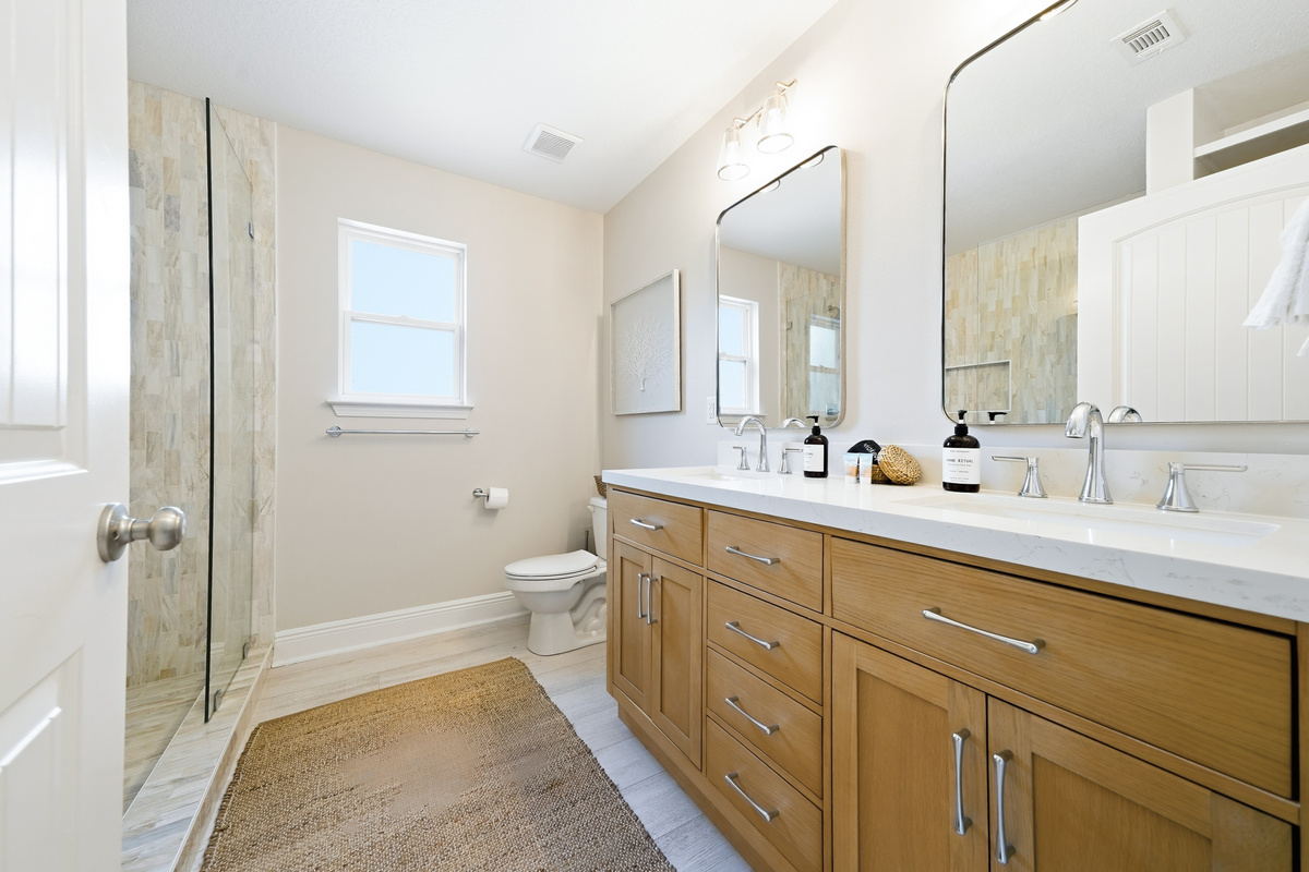 Spa like primary bath with double vanities and double shower