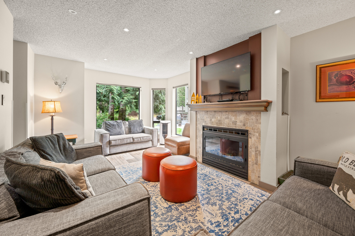 Another view of the 211 sq ft main-floor living room, the gathering space in this 4-bedroom home that sleeps 10.