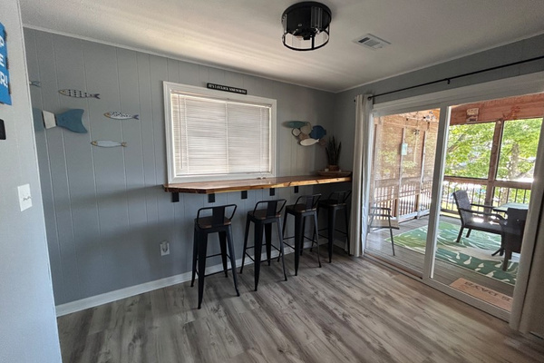 Bar top dining near the screened-in deck.