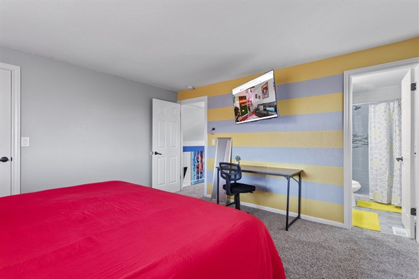 Bold colors, big comfort, and a private bath to match — this king bedroom with ensuite is the perfect place to unwind.