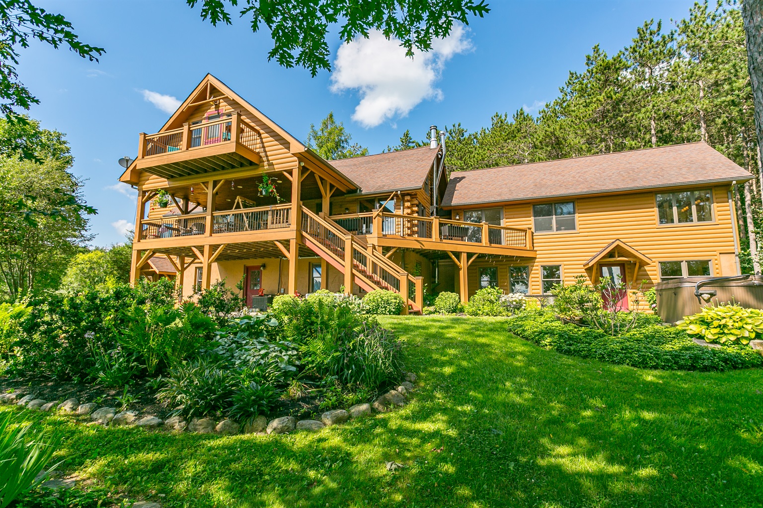Multiple decks and porches provide sweeping views and endless spots to relax, dine, and enjoy the outdoors in style.