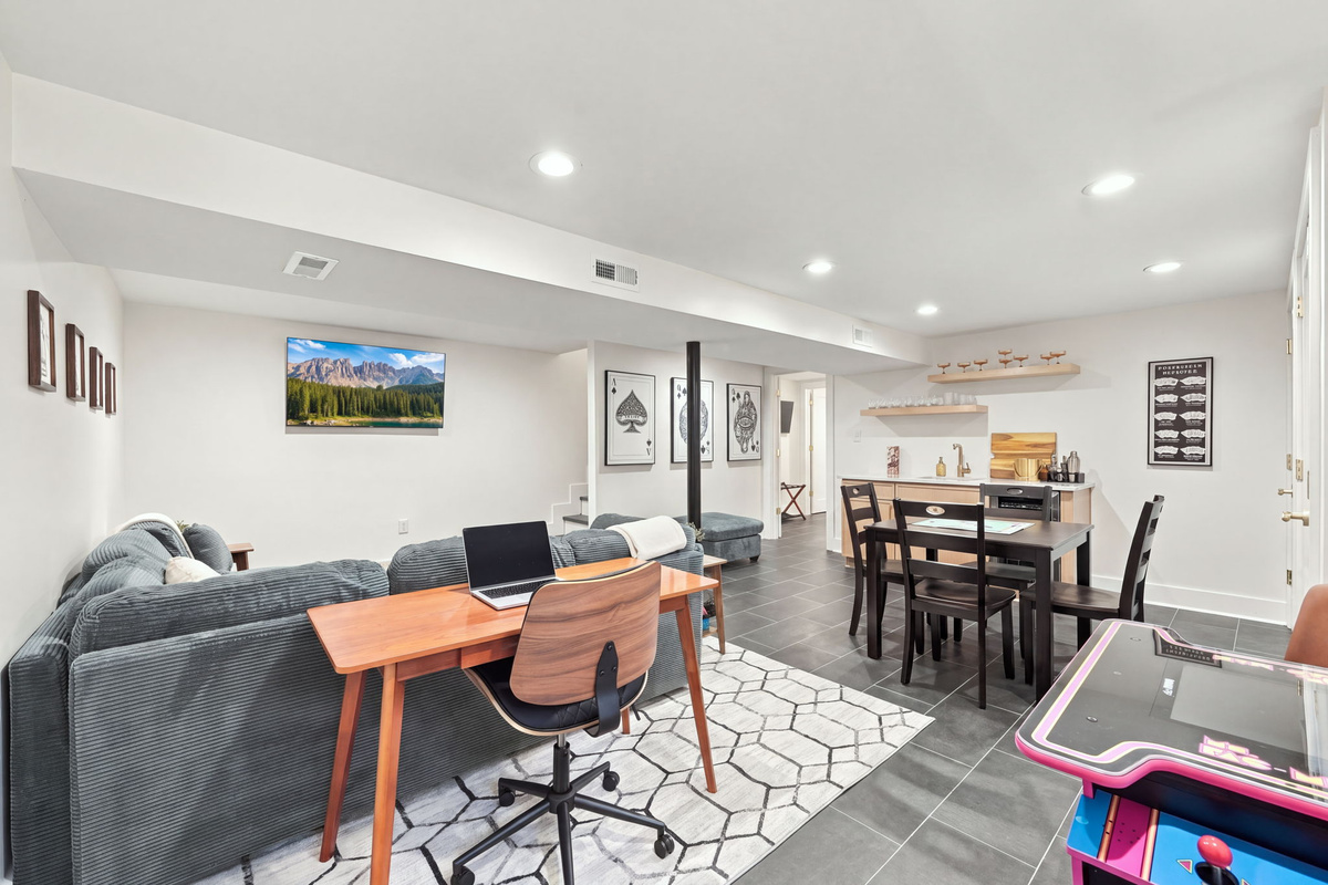 Spacious Basement Retreat: Enjoy a stylish vibe with entertainment and dining space galore!