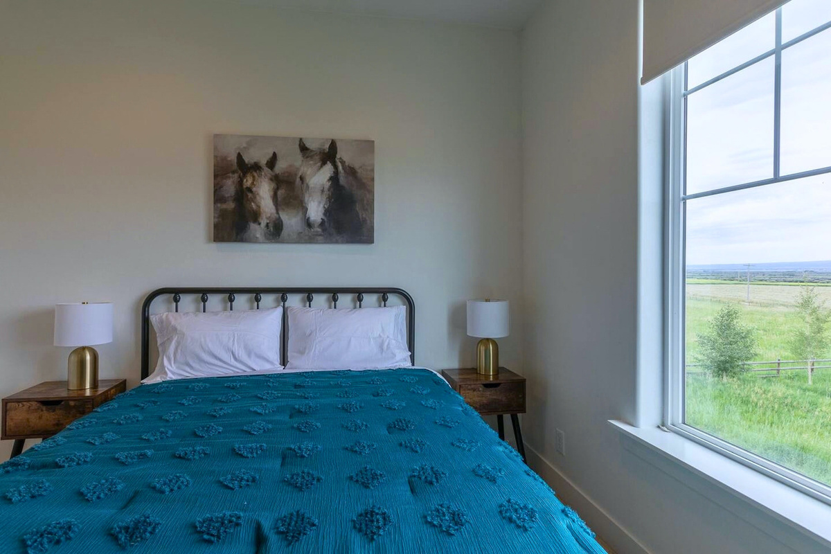 Bedroom 5 features a queen bed and matching nightstands for comfort and convenience
