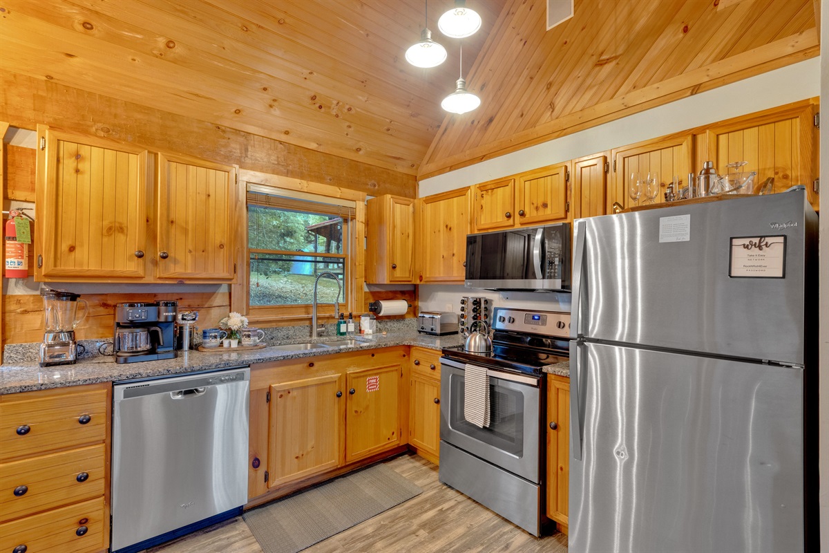 Full kitchen with stainless steel appliances, granite counters, and all the essentials