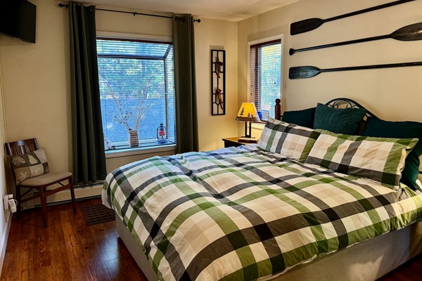 Relax in a California King bed with plush memory foam mattress, and down comforter and blackout curtains for solid rest after long days.
