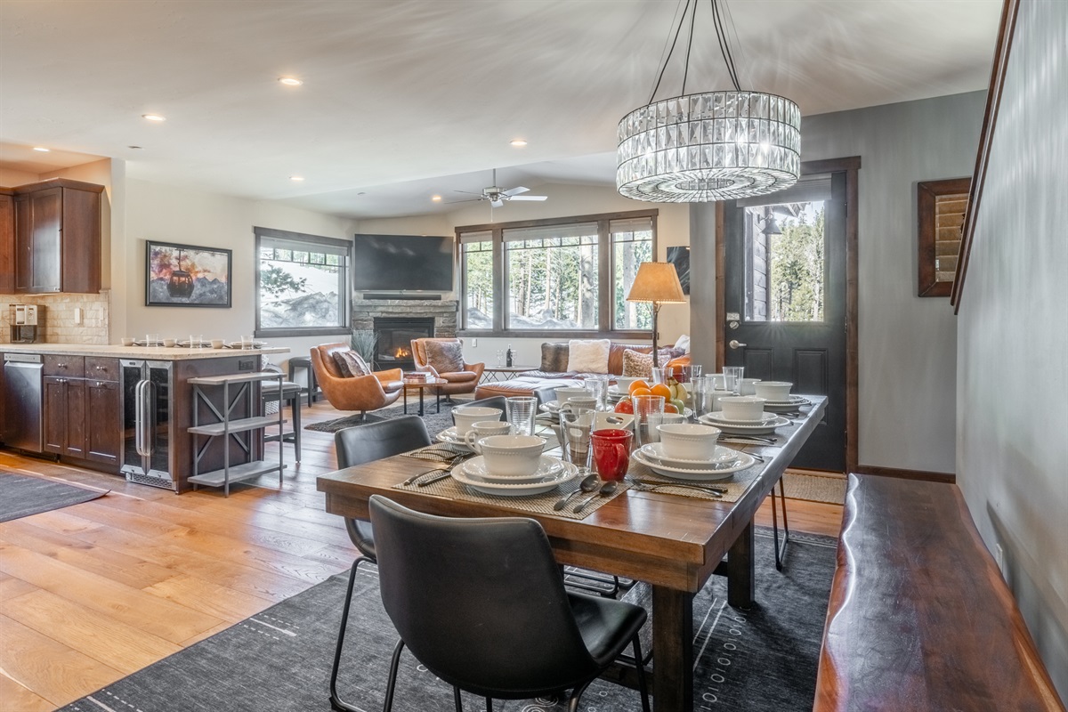 Gather ’round the long table with bench seating—perfect for group dinners, game nights, or even remote work sessions. With the dining room open to the kitchen and living rooms, everyone stays connected while doing their own thing.