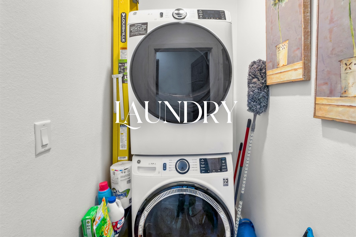 A tucked-away laundry area adds everyday convenience, making longer stays feel effortless and comfortable.
