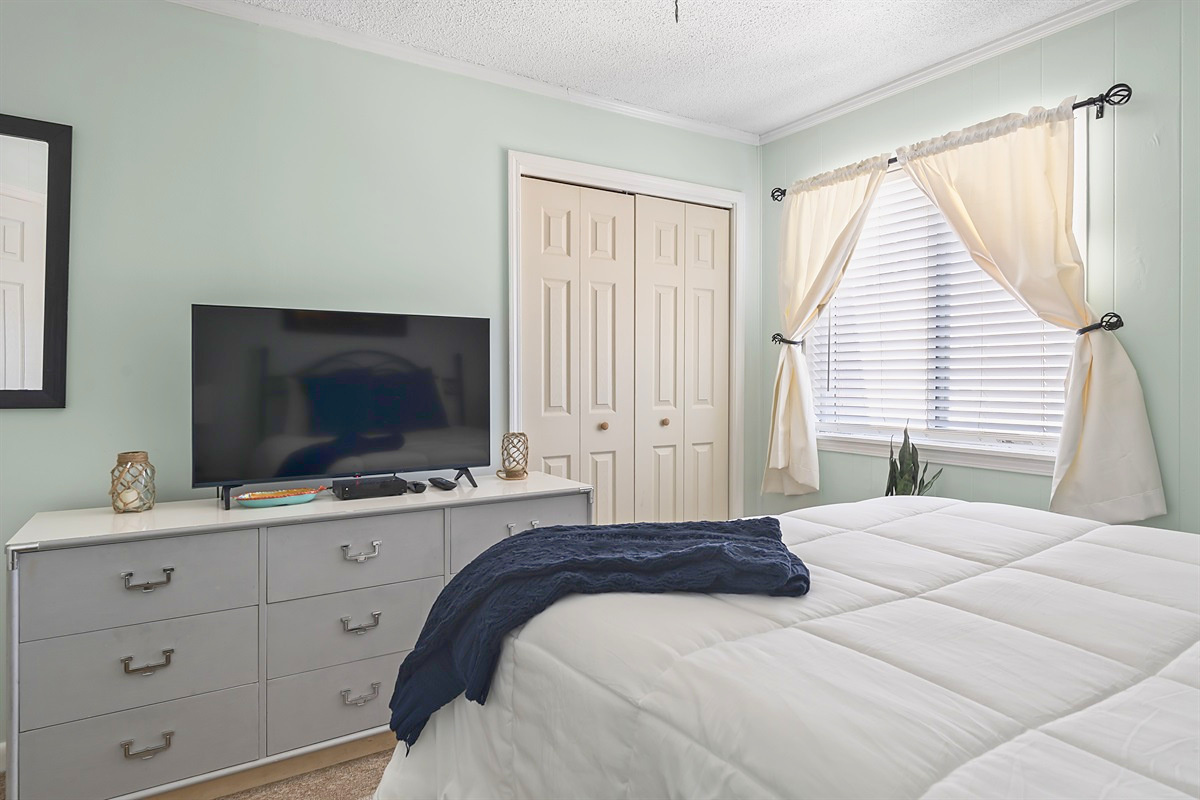 Primary Bedroom – Dresser, smart TV and plenty of storage