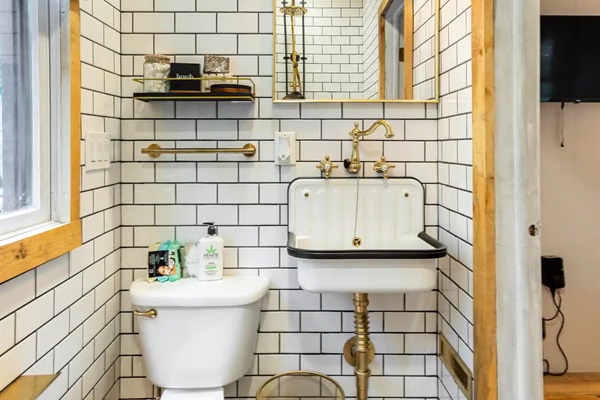 Downstairs bathroom wrapped in stylish subway tile.