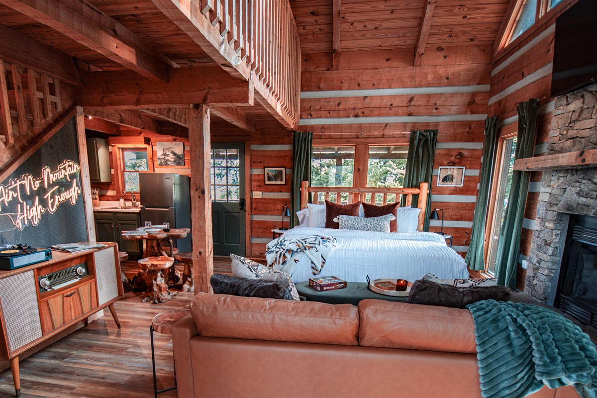 Custom furniture & curated design elevate the backdrop of your mountain escape! A vintage record player, 55 inch ROKU TV and full kitchen are perfect for those cozy nights in with your love.