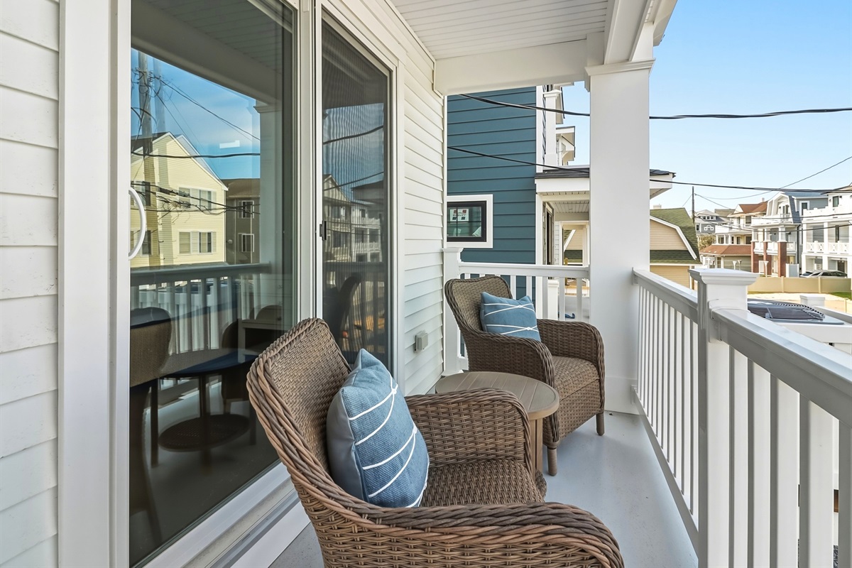 Spacious balcony area with outdoor furniture