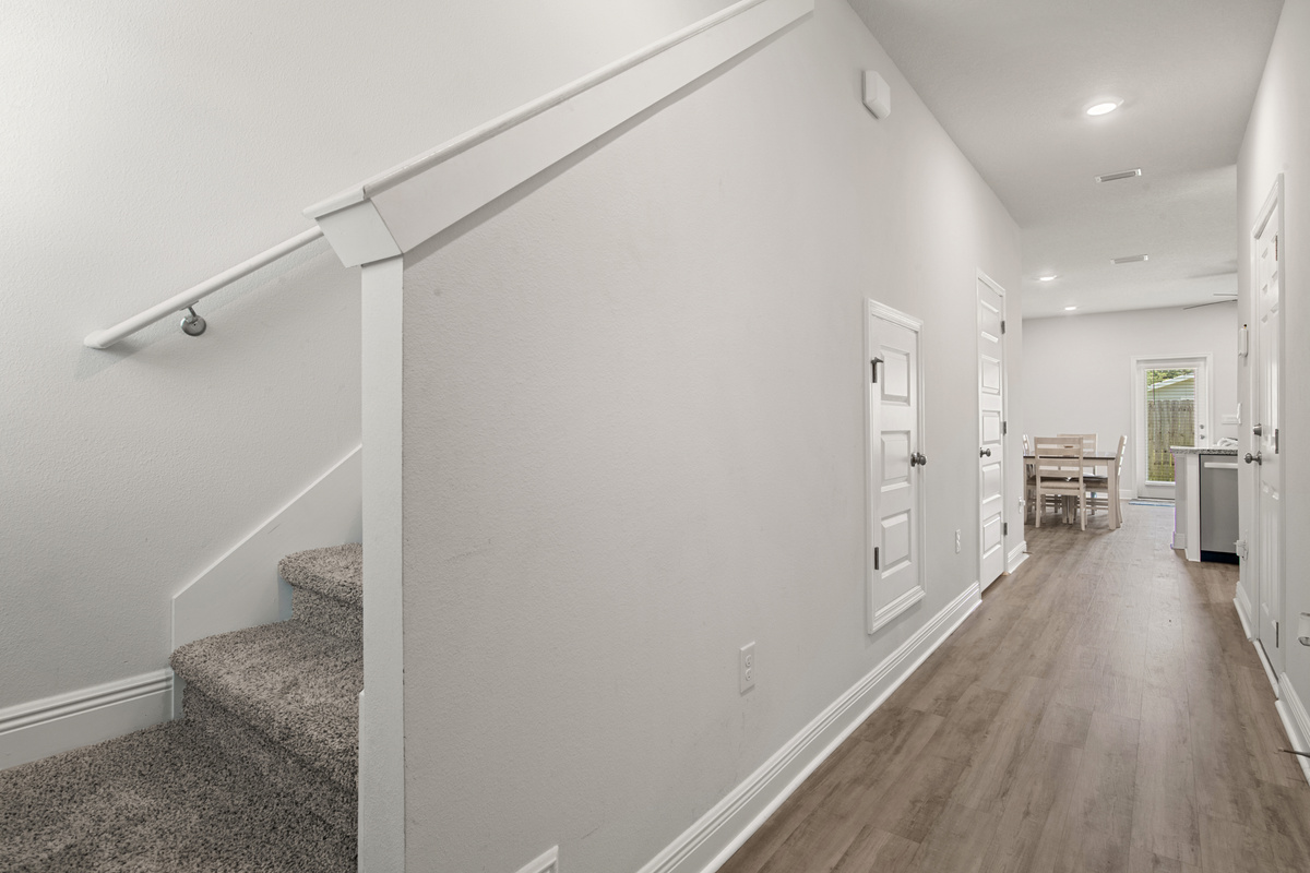 Stairs lead up to the second floor bedrooms and laundry.