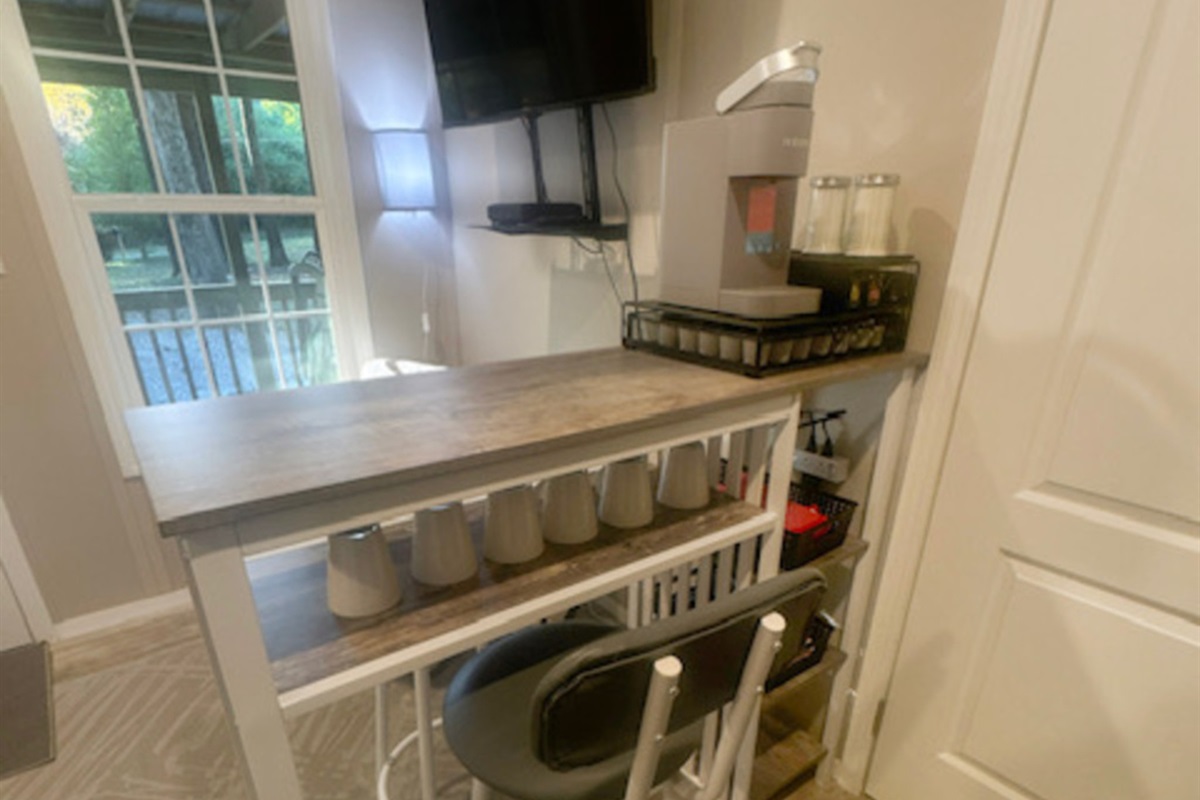 Dining table with 2 chairs and coffee bar