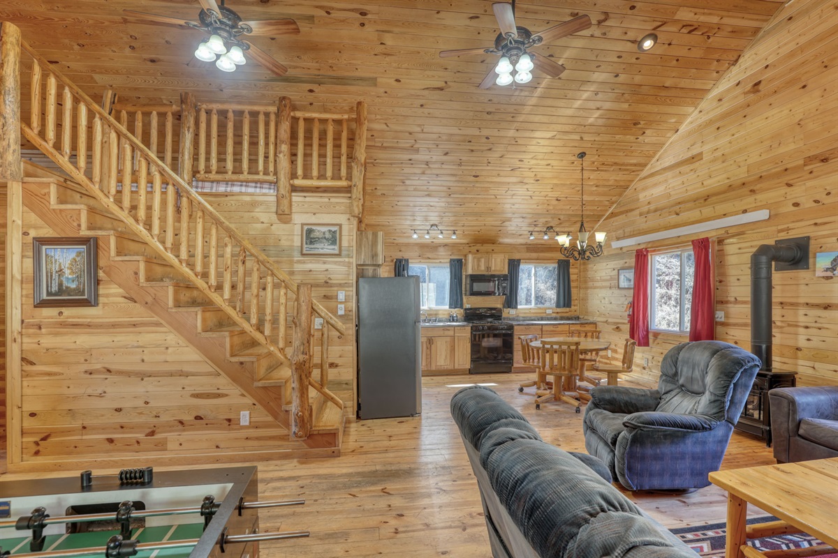 Living area with steps up to loft