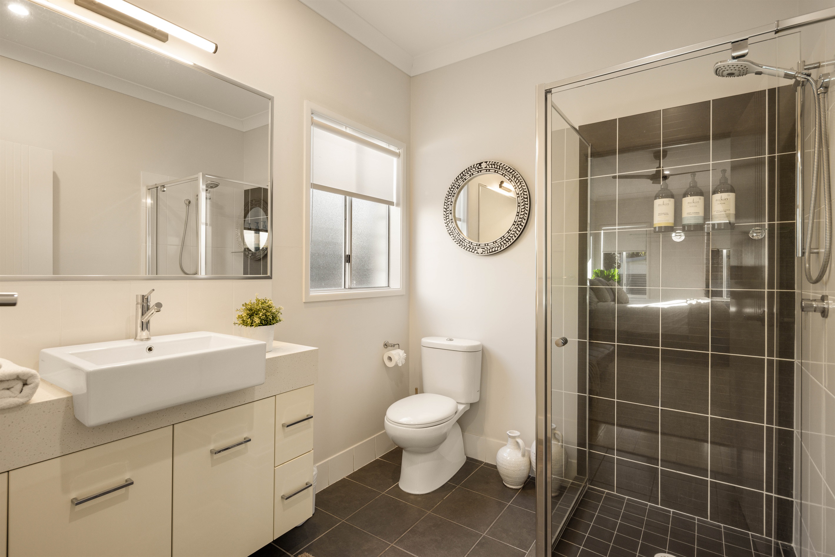 Private ensuite with shower, and modern finishes.