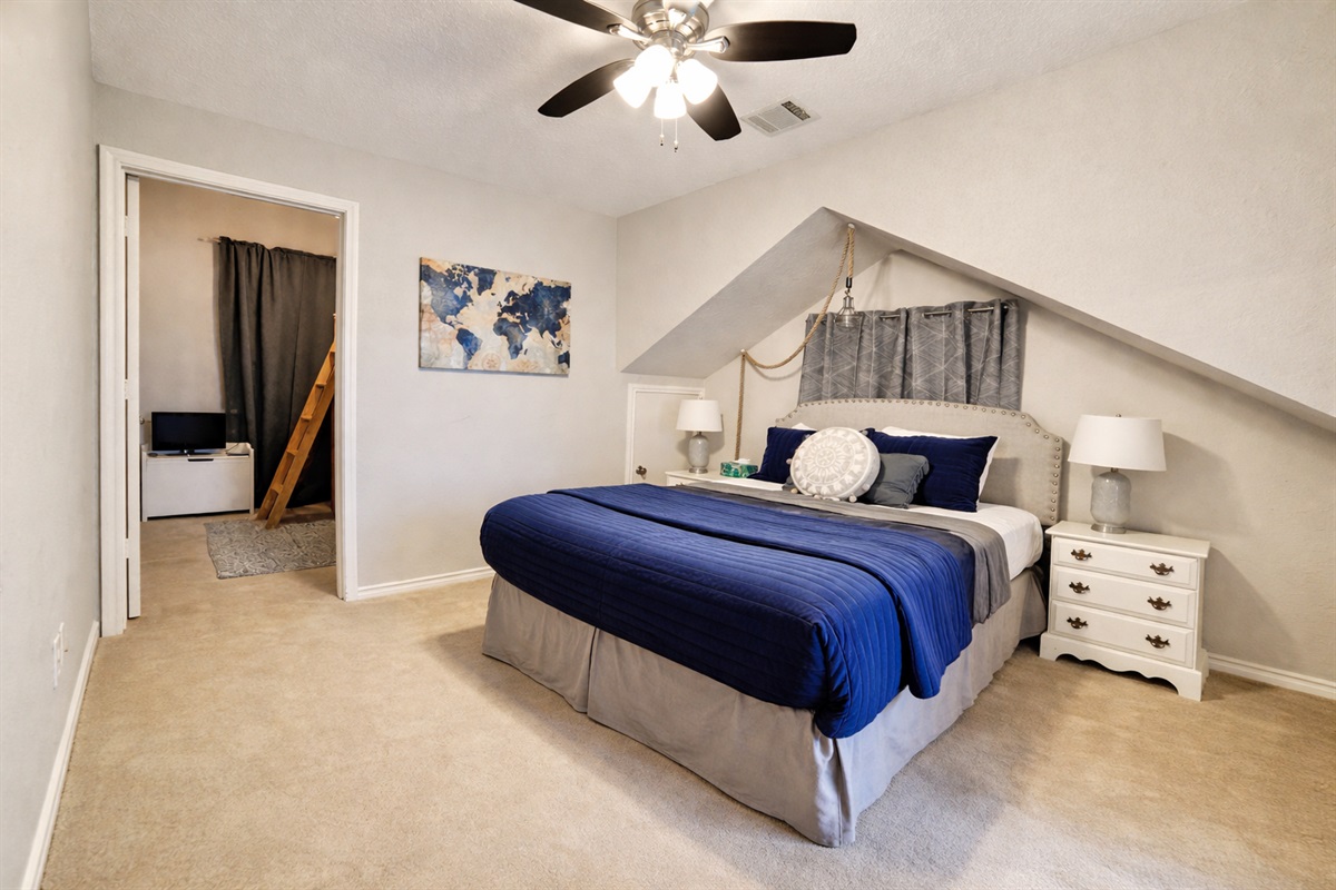 Queen bedroom on top floor with bunk bed nook and private restroom