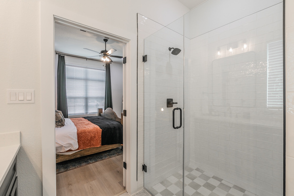Main bathroom with double vanity and walk-in shower