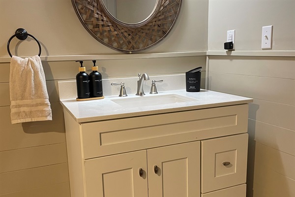 Clean, modern vanity stocked with essentials to make your stay easy
