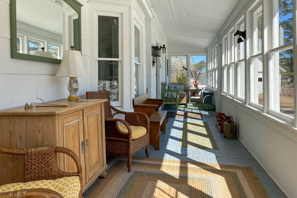 Sizable front porch, several areas for sitting and watching the birds in the front yard.