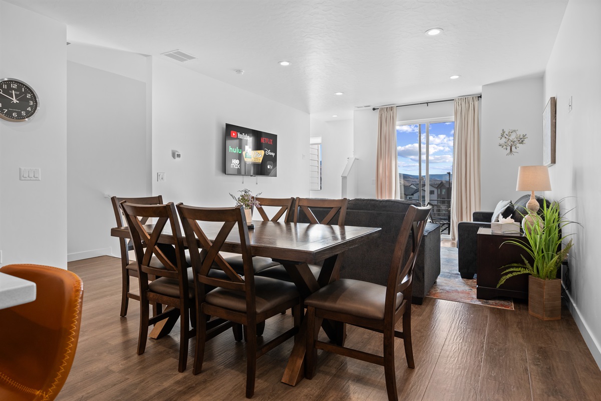 Dining area with seating for the whole group and natural light.