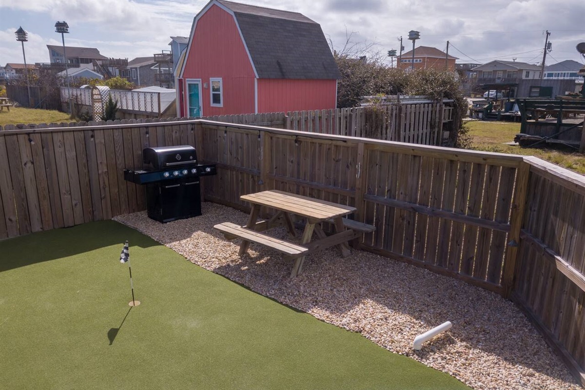 Grill burgers on the gas grill for dinner while watching your kids play in the outside space....