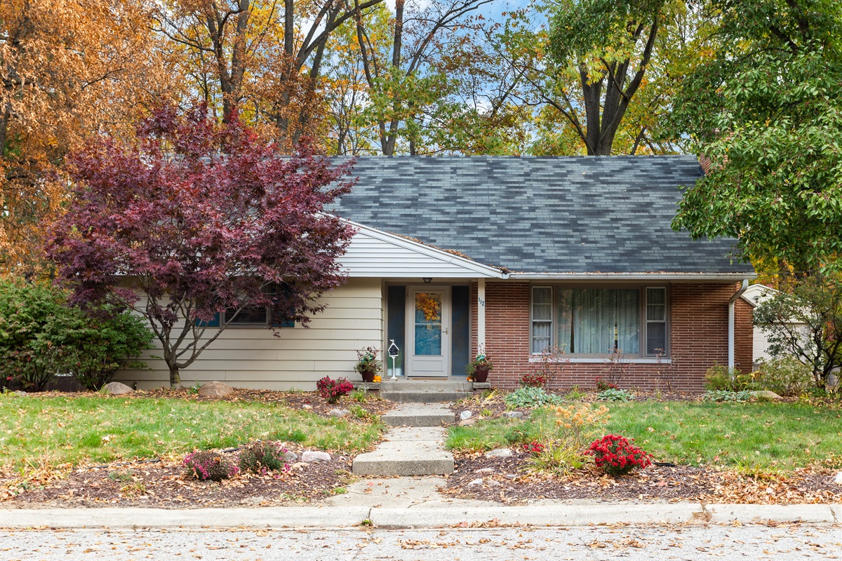 Look for the teal door in the quiet historic Happy Hollow neighborhood.