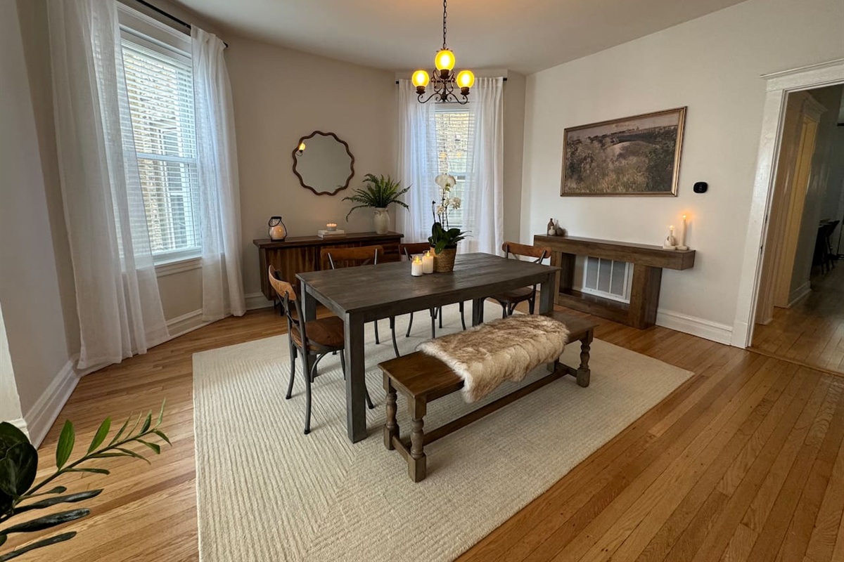 Dining room with large table perfect for group meals.