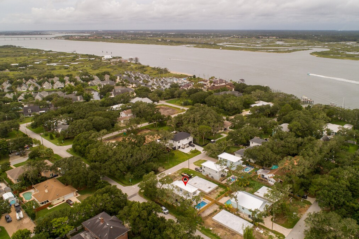 Turn the other way and the Intracoastal opens up: the Tolomato River, the marsh grass, and boats running south toward the bridge. Sunset over this water is well worth the few minutes it takes to walk down to it.