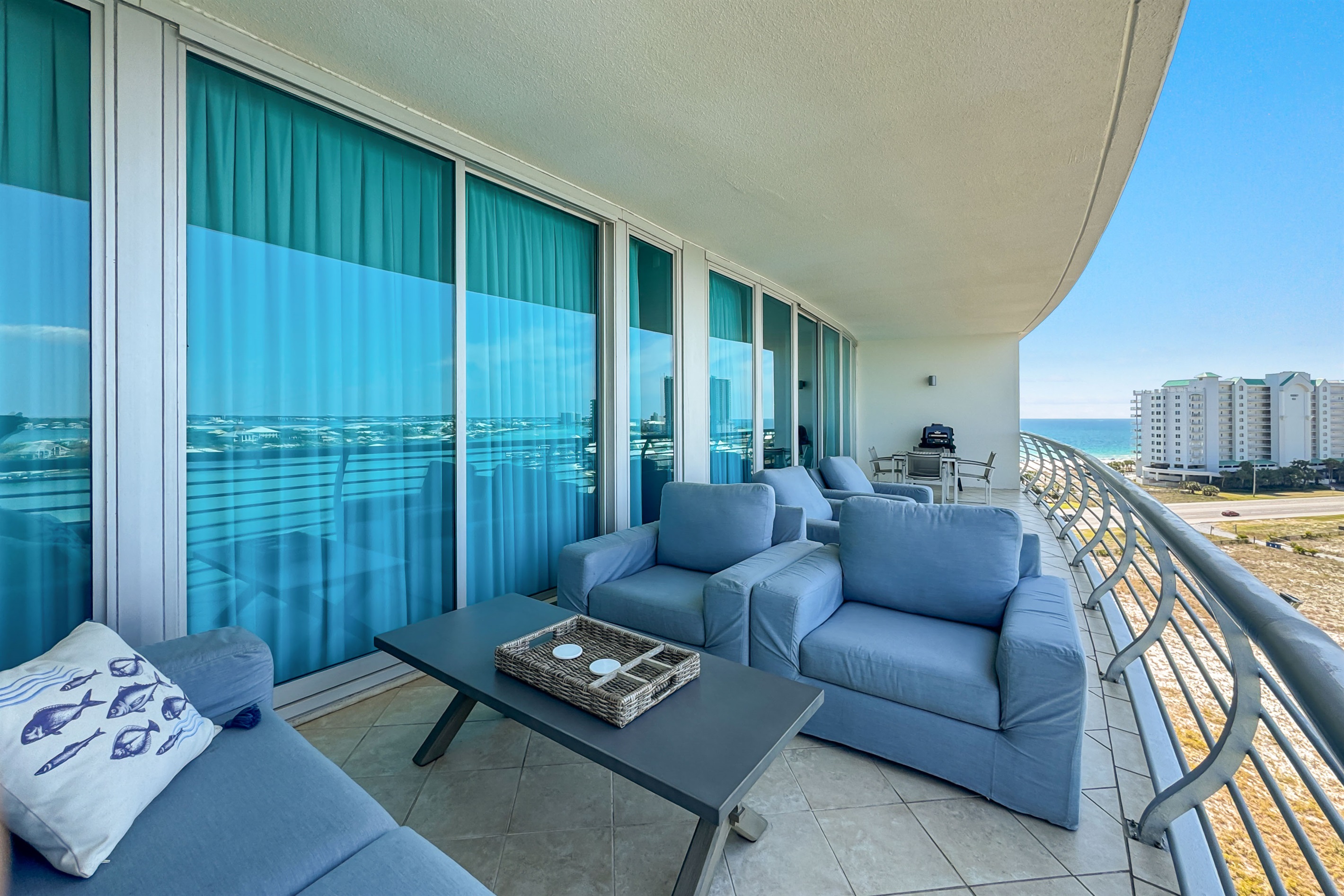Elevated living at its finest. This spacious balcony offers breathtaking vistas of the bay, providing an idyllic setting for morning coffee or evening sunsets. Experience the ultimate in waterfront luxury.