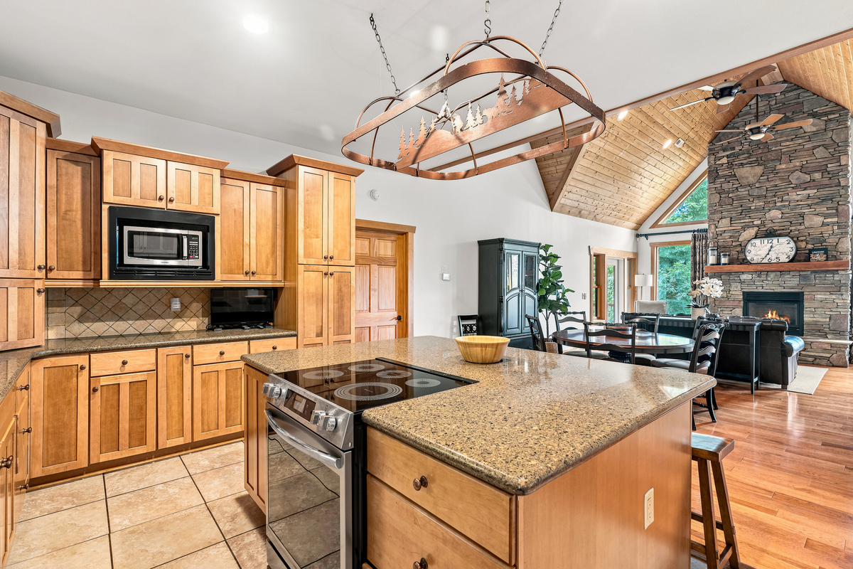 In addition to the smooth-top range, dishwasher with hidden controls, and microwave, there is a TV