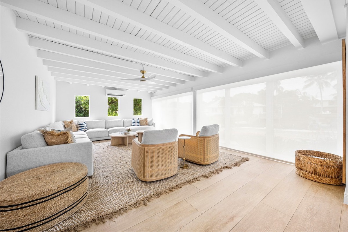Light filters gently through this tranquil space, enhancing the natural palette and refined beach house aesthetic.