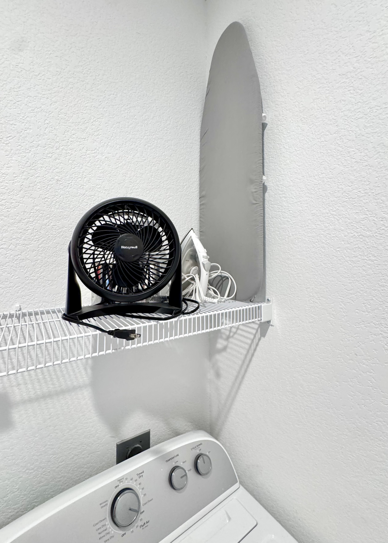 Ironing board, iron, and extra nightstand fan