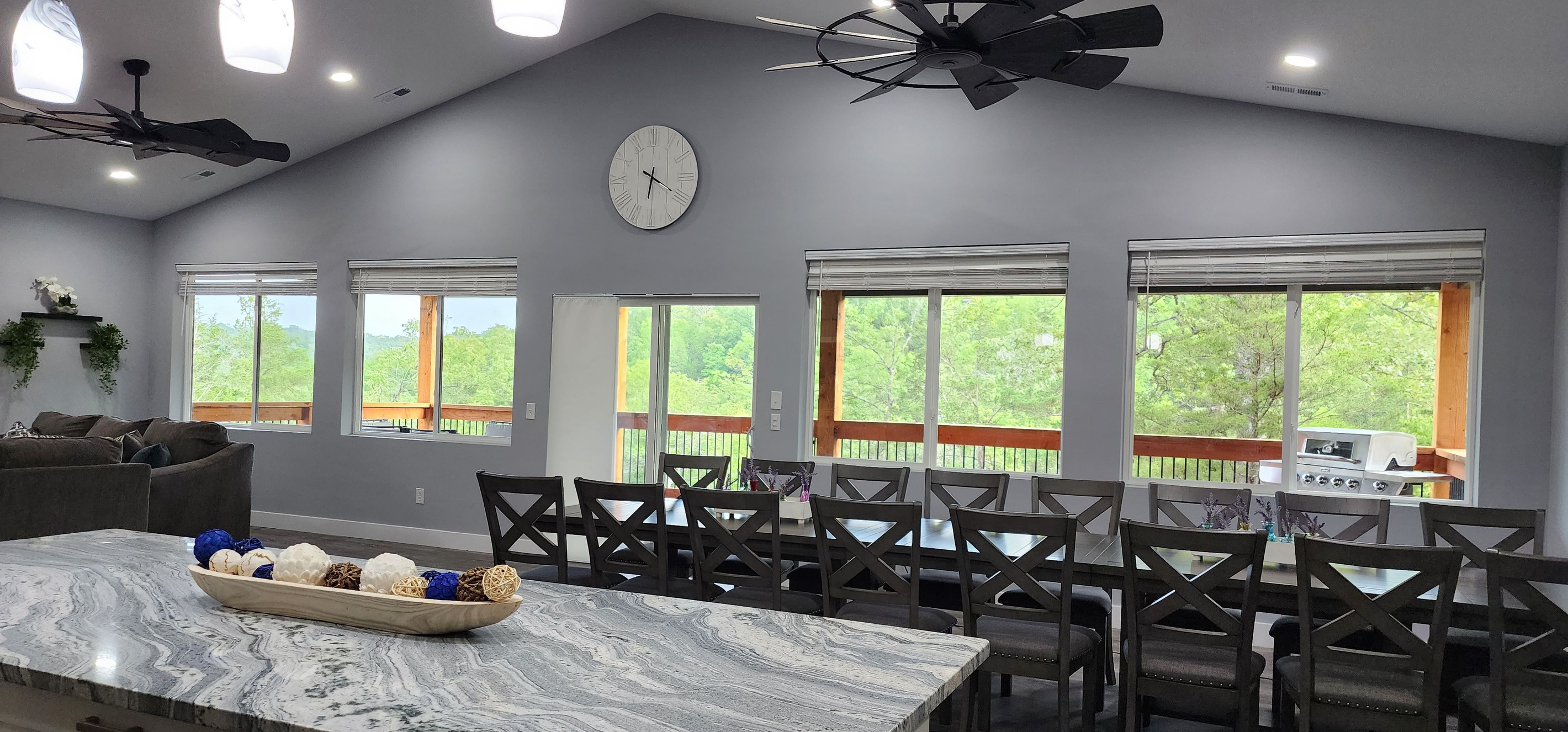 Spacious dining and gathering space with beautiful wooded views.