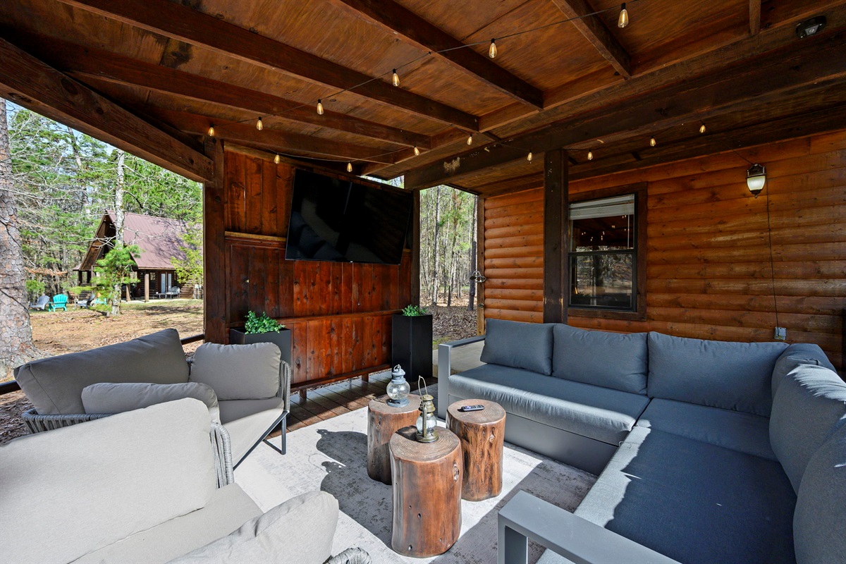 Spacious and shaded, this outdoor space makes every conversation feel elevated without leaving the cabin.