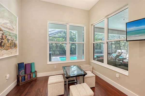 Activity room featuring yoga mats, TV and the Infinity gaming table