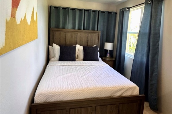 Suite Five queen bed overlooking the sea