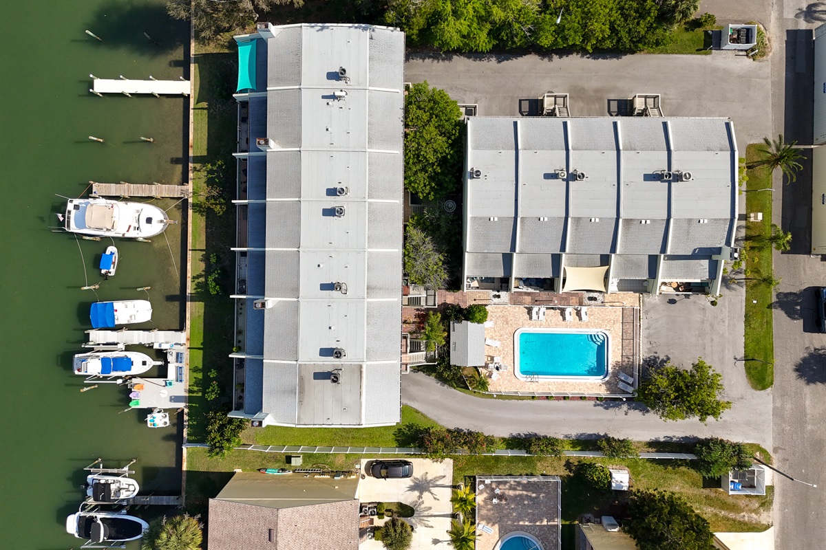 Overhead view of the building, pool and parking