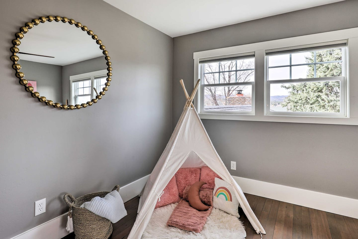 A teepee tucked in the corner turns this room into an instant hideaway for the little ones.