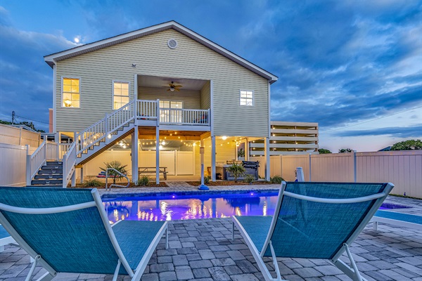 Enter a realm of enchantment as our swimming pool transforms under the night sky. Illuminated by gentle lights, its waters shimmer with quiet elegance, inviting you to unwind in the tranquil embrace of evening. Welcome to your oasis